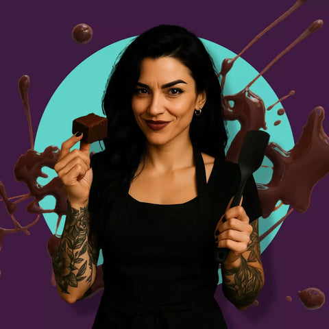 Veronica Savage holding a brownie and spatula — Crude Crumbs founder image. Bold postal brownies UK brand with savage, sassy and soulful gifts. Funny treats with attitude, unapologetically indulgent and handmade.